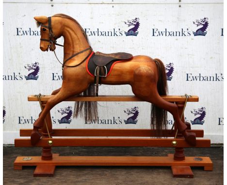 An exceptional handmade ash child's rocking horse, made in Britain by White Horses of Welwyn Hertfordshire, having leather sa