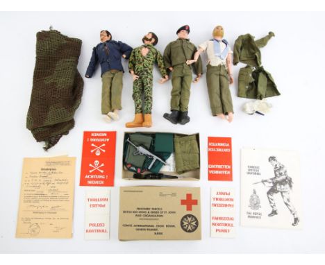 Four vintage Palitoy Action Man figures and a  quantity of clothes and accessories.  (qty)