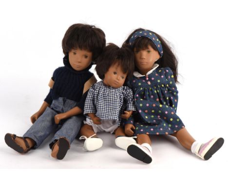 A vintage Trendon Sasha doll 'Gregor' dressed in jeans and blue jumper, 41cm and two further Trendon Sasha dolls ; Brunette g