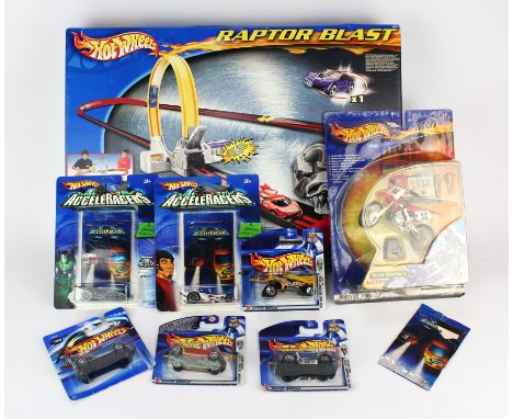 A Hotwheels 'Raptor Blast' track set, six Hotwheels die-cast cars and a Hotwheels motorbike, all boxed.  (8)