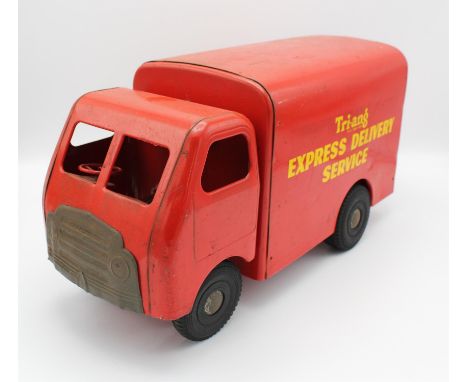 A vintage Triang 'Express Delivery Service' truck, red livery with yellow sign written sides. 21cm high, 40cm wide.