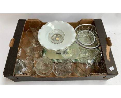 A quantity of glassware to include gold-rimmed jug and glasses, together with a quantity of oil lamp chimney glasses 
