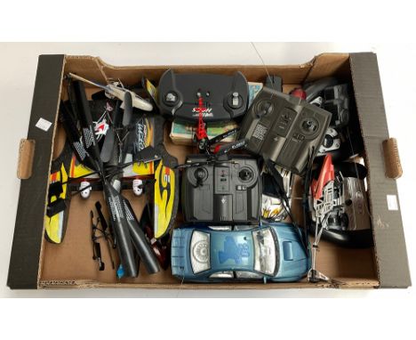 A vintage wood block puzzle with pictures in original box and a quantity of remote-control helicopters and cars 