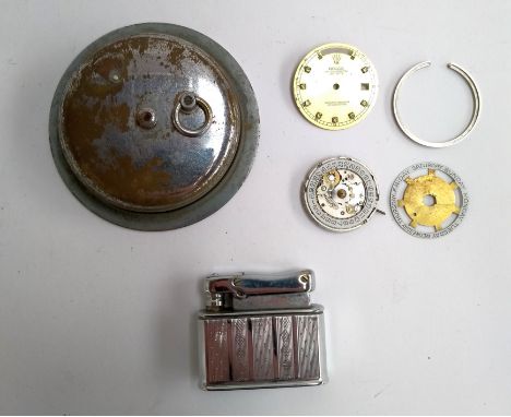 Parts of a Rolex watch dial; together with a Colibri Monopol Empire lighter and a vintage car clock