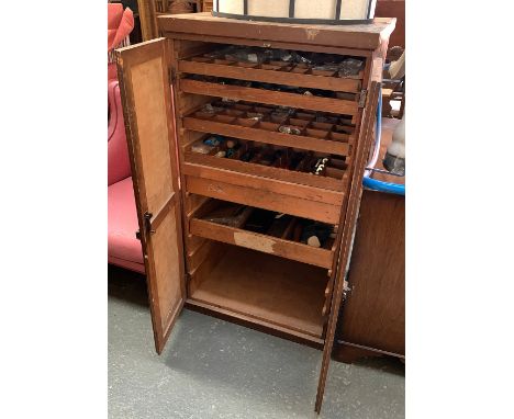 A pine cabinet with six slides containing a quantity of tools and fittings, 67x69x124cmH 