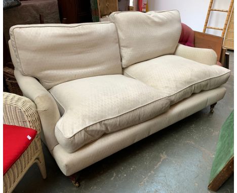 A Highly Sprung Ltd. three seater sofa, on turned legs and brass casters, approx. 183cmW 