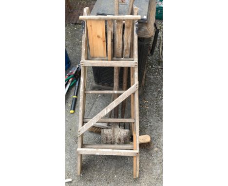 A small folding stepladder; together with shovel, fork and two brooms 
