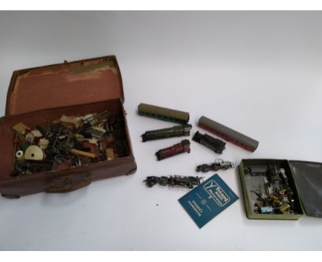 A vintage travel case containing a small quantity of Triang/Jouef train parts