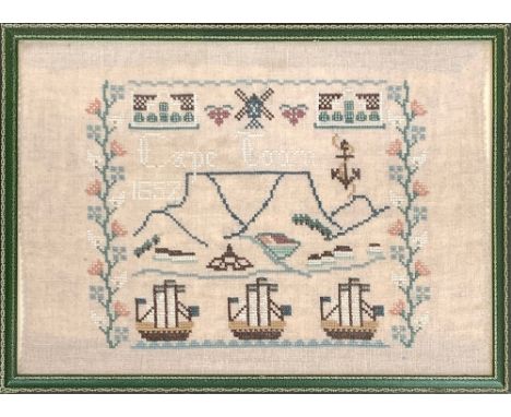 A 19th century sampler, 'Cape Town 1852', in leather frame, 25x35cm 