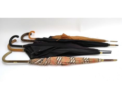 Five vintage umbrellas, to include one Burberry's check pattern umbrella, 85cmL 