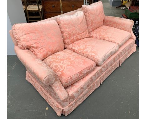 A pink upholstered three seater sofa, with feather filled cushions, approx. 195cmW 