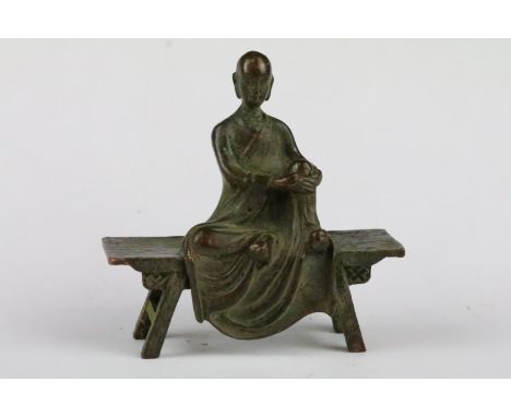 A Chinese bronze of a seated Buddha, approx 8cm in height. 