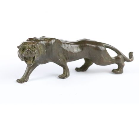 An ornamental Chinese bronze tiger, measures approx 13cm in length. 
