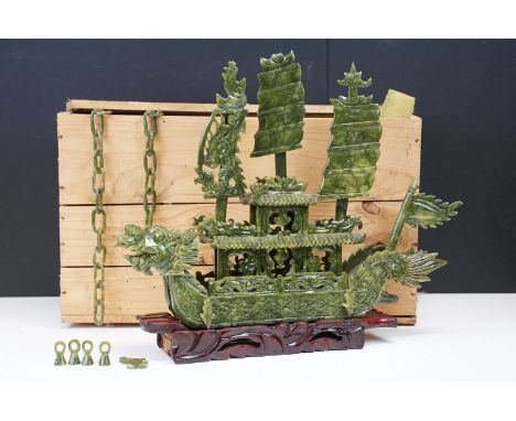 Chinese carved jade dragon boat raised on a hardwood stand, approx 39cm long 