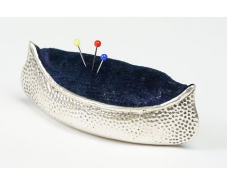 An early 20th century fully hallmarked sterling silver pin cushion in the form of a canoe, makers mark indistinct but believe