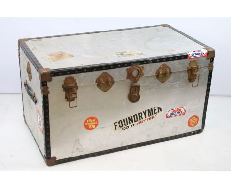Vintage metal travel trunk with souvenir stickers to the sides and lids and metal locks with black banding to edges, 50cm hig