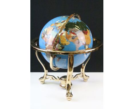 Gemstone globe raised on a brass lacquered stand with inset compass to base, approx 47cm tall