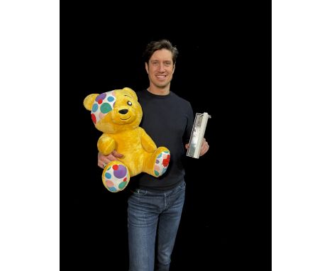 A one-off handcrafted silver bookmark, embossed with Pudsey Bear, and a Pudsey soft toy signed by BBC Radio 2 presenter Verno
