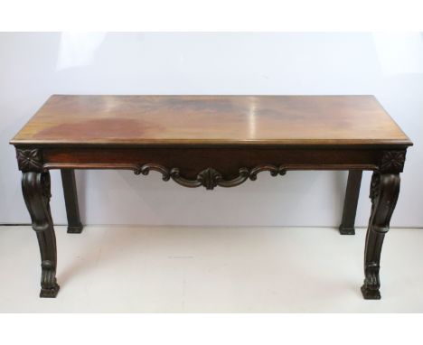Victorian mahogany side table with carved apron, with elaborately carved legs, 73.5cm high x 151cm wide x 56cm deep 