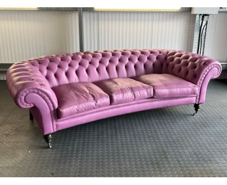 Three seater lilac / pink leatherette contemporary Chesterfield sofa, with button back back and arms, on turned legs and cast