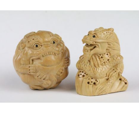 Two carved wooden netsuke figures in the form of dragons, 5cm approx 