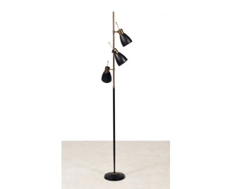 MONIX FLOOR LAMP, 1960Floor lamp with a circular base comprising a central stem in black metal extended by a brass with a bra