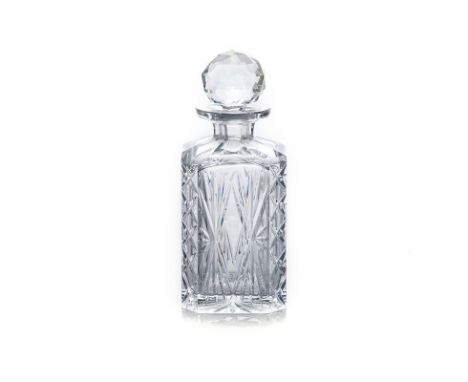 A CRYSTAL CUT DECANTER AND STOPPER, 20TH CENTURY of canted square-section form with star cut base, with faced stopper 23,5cm 