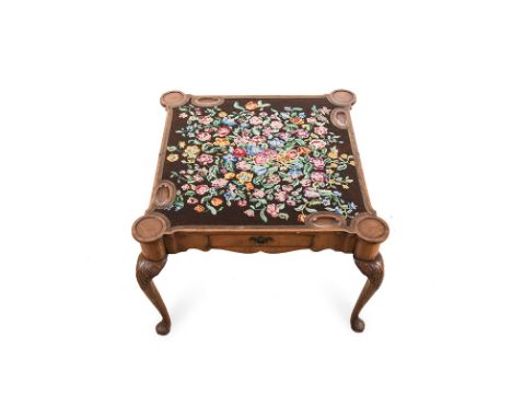 A WALNUT CONCERTINA GAMES TABLE, 19TH CENTURY the rectangular shaped hinged top enclosing a woven floral playing surface, sha