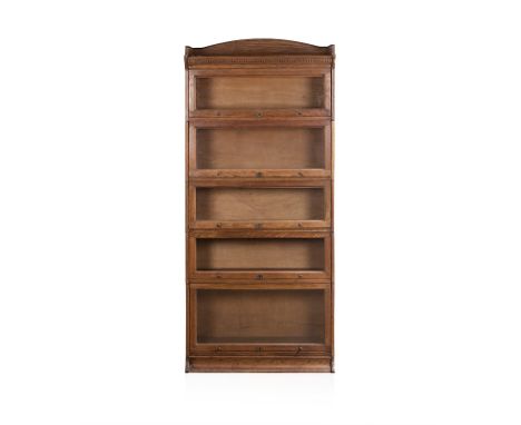 AN OAK LEGAL BOOKCASE, 20TH CENTURY the rectangular top above a dentil frieze, surmounted by a shaped three-quarter gallery, 