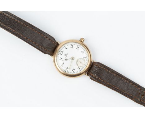 A 9CT GOLD CASED WRISTWATCH BY OMEGA, the circular dial with Arabic numerals and subsidiary seconds dial, to a jewelled manua