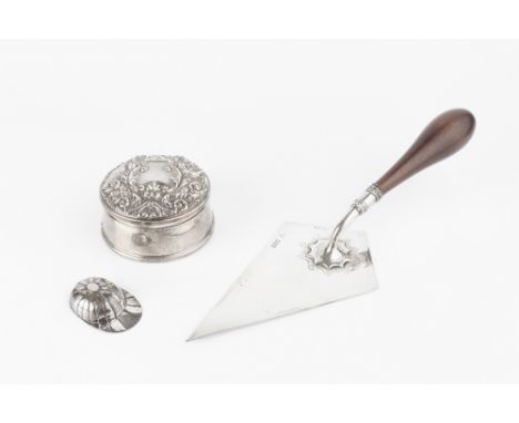 AN IRISH SILVER PRESENTATION TROWEL, with turned hardwood handle, by Garrard &amp; Co, Dublin 1975, 29.5cm long overall; a si