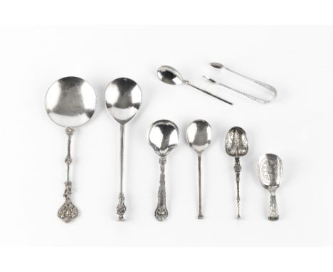 A LATE 19TH CENTURY SILVER SERVING SPOON, with figural handle, by William Hutton &amp; Sons, London 1897, another with figura