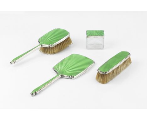 AN ART DECO SILVER AND GREEN ENAMEL DRESSING TABLE SET, comprising mirror, hairbrush and clothes brush, by Walker &amp; Hall,