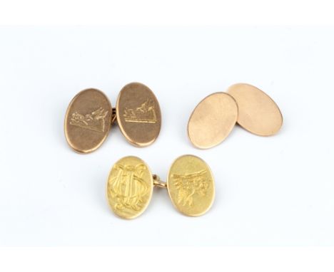 THREE CUFFLINKS, each with oval panels and chain-link fittings, the first with engraved monogram and crest, stamped '15ct', t