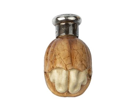 A LATE VICTORIAN SILVER MOUNTED CERAMIC NOVELTY SCENT BOTTLE, by Sampson Mordan, modelled as a partly cracked walnut, printed