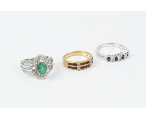 A COLLECTION OF DIAMOND AND GEM SET RINGS, comprising an emerald and diamond dress ring, the oval mixed-cut emerald claw set 