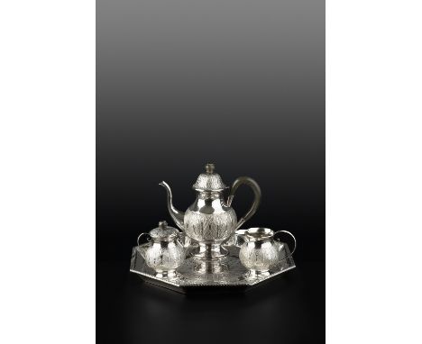 A MALAYSIAN THREE PIECE TEA SERVICE, on matching tray, comprising baluster teapot, twin handled sucrier and cover, and milk j