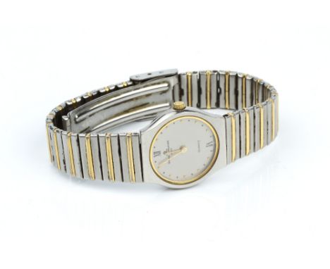 A LADY'S BRACELET WATCH BY BAUME &amp; MERCIER, the circular signed silvered dial with bead markers, to a tapered articulated