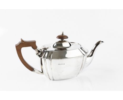 A SILVER TEAPOT, with Art Deco style shaped body, composition handle and knop, by C.W. Fletcher &amp; Son Ltd, Sheffield 1931