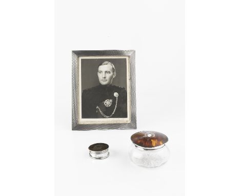 A SILVER RECTANGULAR PHOTOGRAPH FRAME, with engine turned decoration, by Samuel M. Levi, Birmingham 1931, 26cm high; a silver
