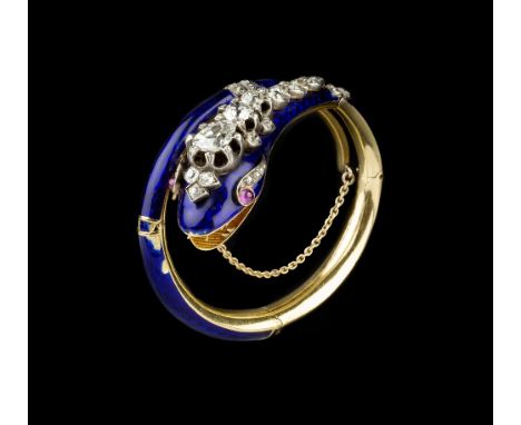 A VICTORIAN ENAMEL AND DIAMOND SET SERPENT BANGLE, designed as a coiled blue enamel serpent of hinged form, his head applied 