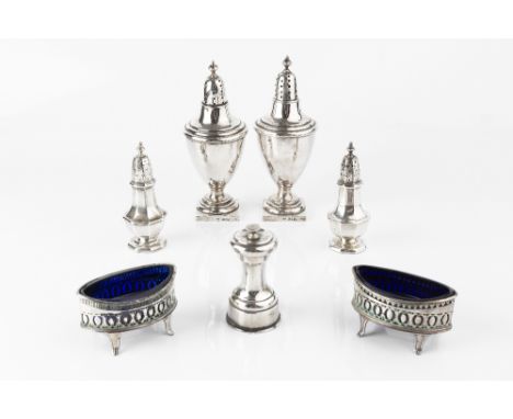 A PAIR OF LATE VICTORIAN SILVER URN FORM SUGAR CASTORS, on square bases, by Minshull &amp; Latimer, Birmingham 1893, 18cm hig