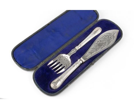 A PAIR OF MID VICTORIAN SILVER FISH SERVERS, with pierced and engraved decoration, by Harrison Bros &amp; Howson, Sheffield 1