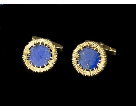 A PAIR OF LAPIS LAZULI CUFFLINKS, each circular lapis lazuli panel inset to an abstract textured mount, on hinged baton fitti