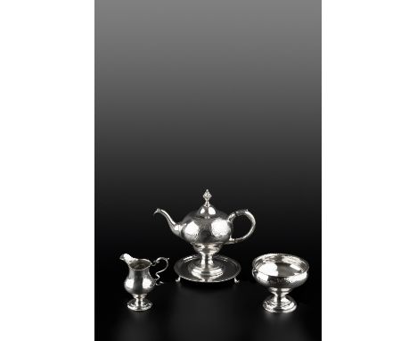 A GEORGE III SCOTTISH SILVER THREE PIECE TEA SERVICE comprising pedestal teapot, with inverted pear shaped body, circular sta