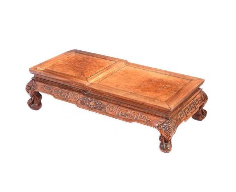 CHINESE HARDWOOD OPIUM TABLE WITH CARVED APRON. RAISED ON CARVED LEGS IN THE FORM OF AN ELEPHANT TRUNK. HEIGHT: 12 INCHES.WID