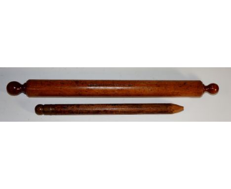 A miniature rolling pin, the removable ends revealing hollow interior containing a pencil, stamped "W.R. Simpson", 32cm long,