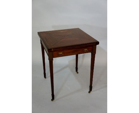 An Edwardian mahogany envelope top card table, boxwood strung, the frieze fitted one single drawer, on fluted square tapered 