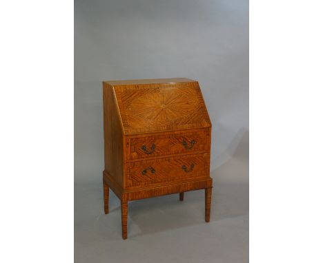 An Edwardian satinwood bureau, the fall-flap inlaid to the centre with a floral patera surrounded by segmental border, within