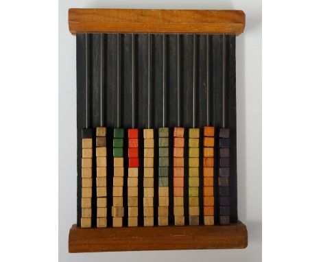 A wooden abacus with cuboid wooden beads strung on metal rails, back inscribed: 'The "Two-Way" Bead Frame - Philip & Tacey, L